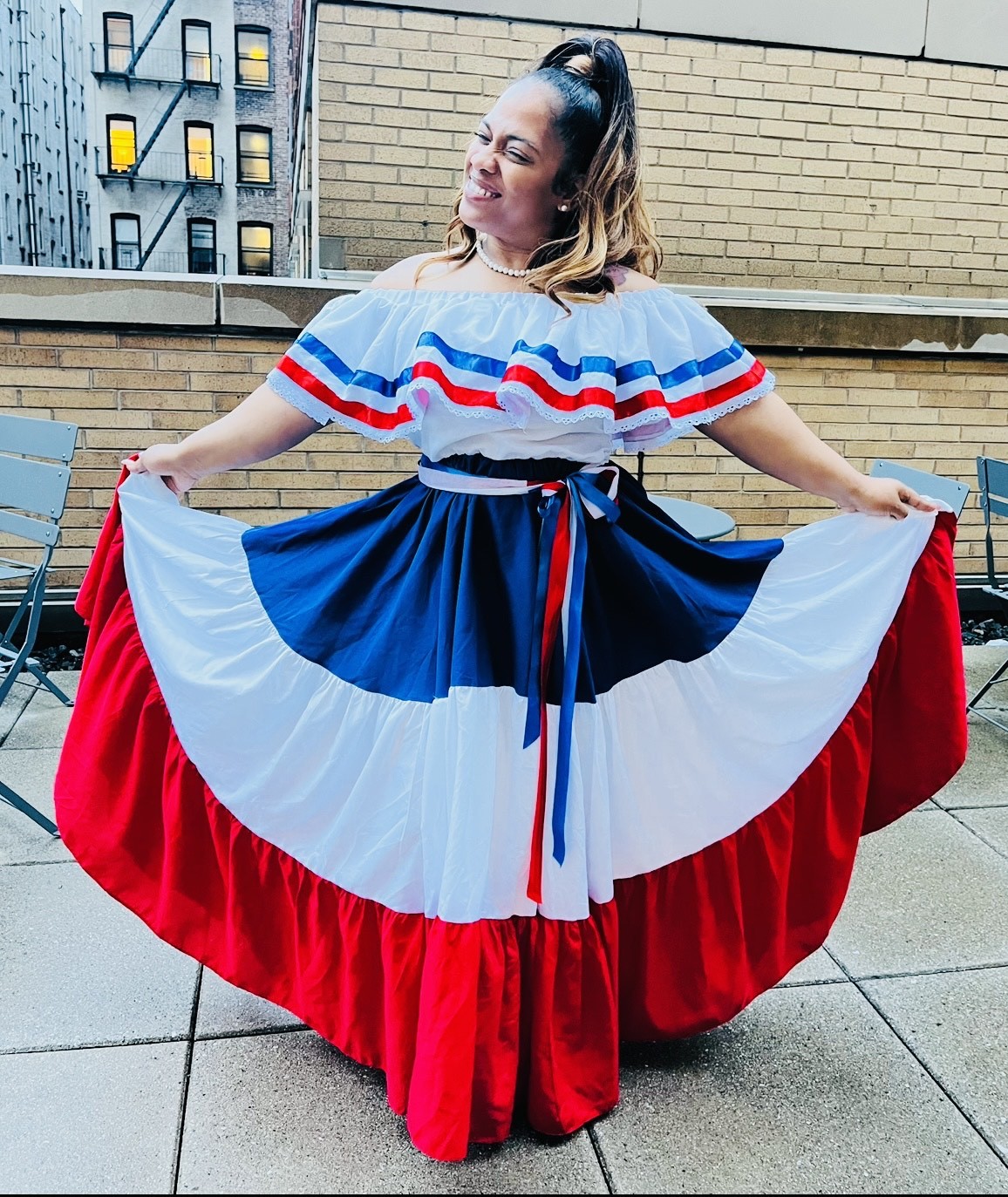 Photo of Trina Nurse in a traditional Dominican dress