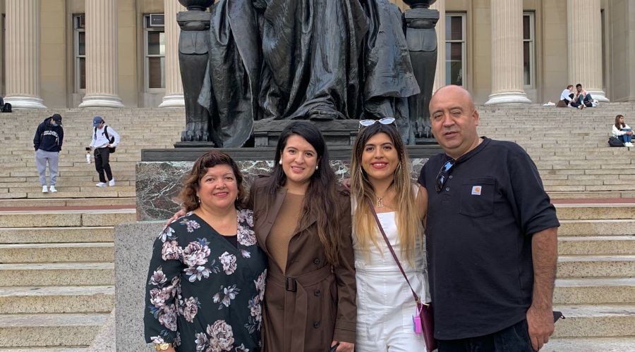 Johanna Martinez and her mom, dad, and sister on Low Steps in front of Alma Statue