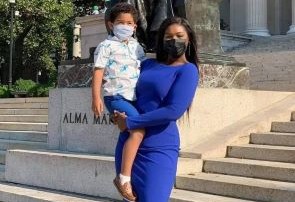 Ebonnie and her son in front of Alma Mater