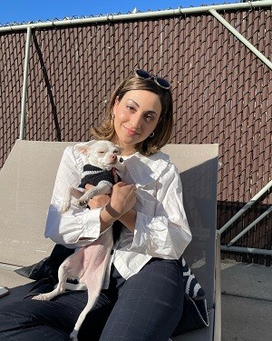 Marissa holding a small dog
