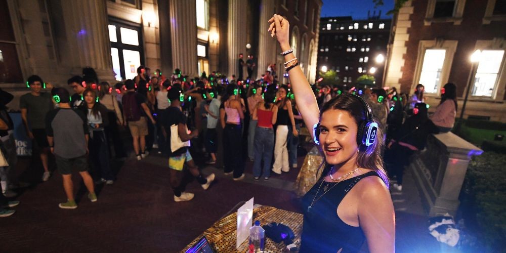 Student DJ dances at Low-lapalooza Silent Disco