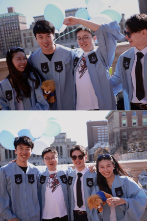 Bingruo with three from high school who are also graduating for Columbia Bingruo with friends in cap and gown at the top of Low Steps