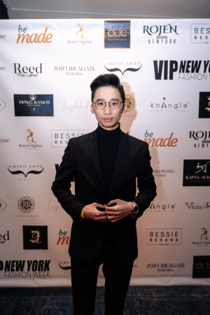 Jeremy in front of step and repeat at New York Fashion Week