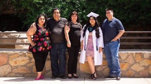 Maggie with her family at her high school graduation