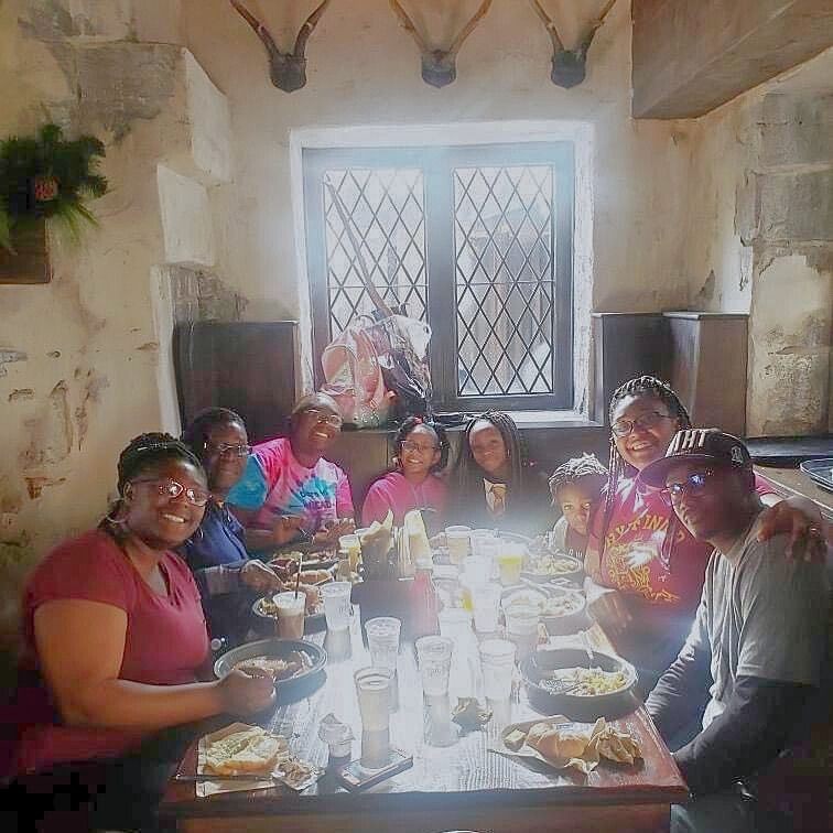Shatize enjoys a meal with her family. Shatize enjoys a meal with her family.