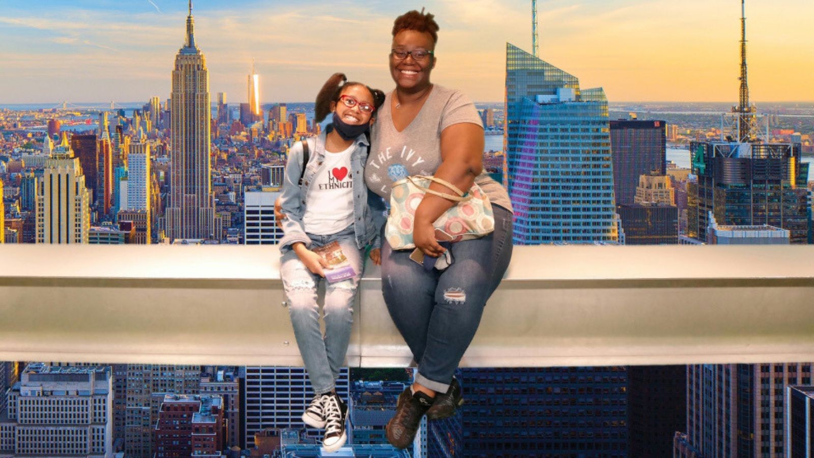 Shatize and her daughter -- NYC skyline at sunset in the background