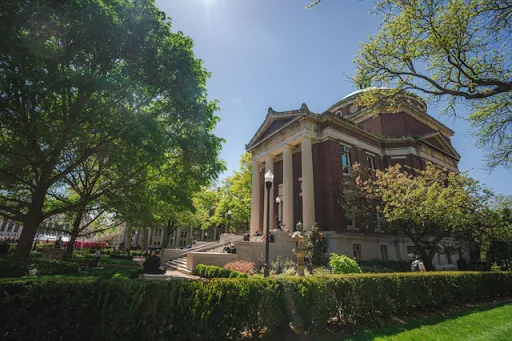 Corner view of Earl Hall, taken from over shrubbery.