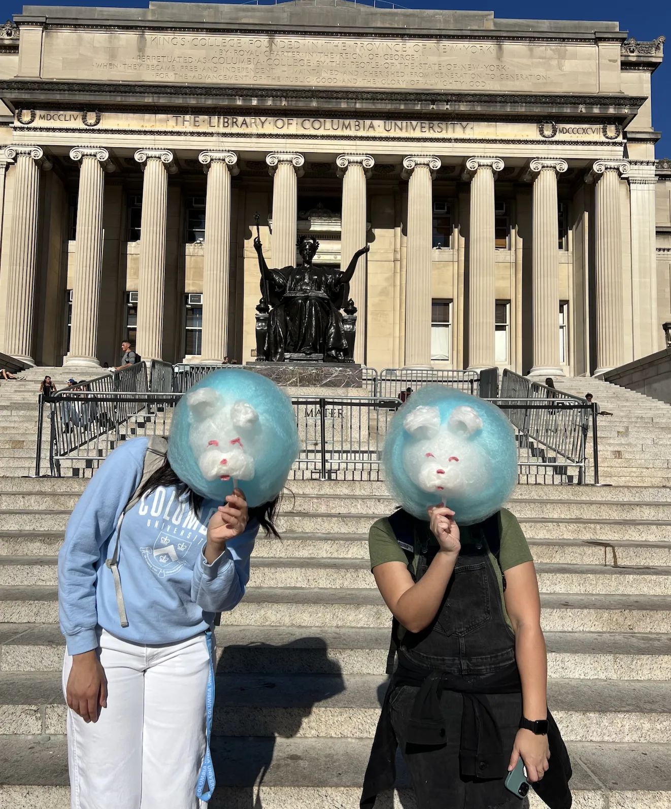Marina Martins posing next to a friend in front of Low Library at Columbia University