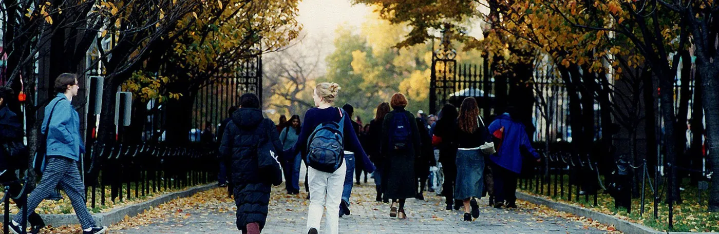 People walk down College Walk on Columbia University's Morningside campus on a fall day.