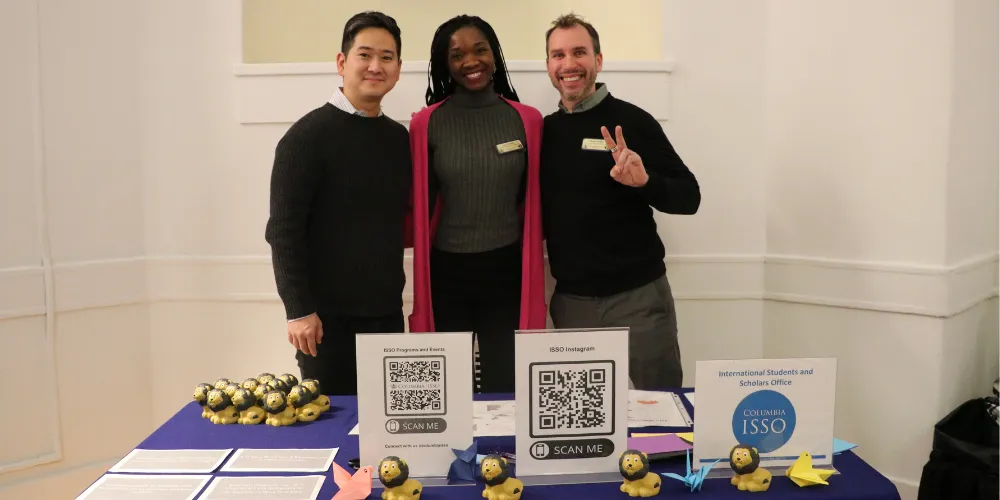 ISSO Staff poses at welcome table