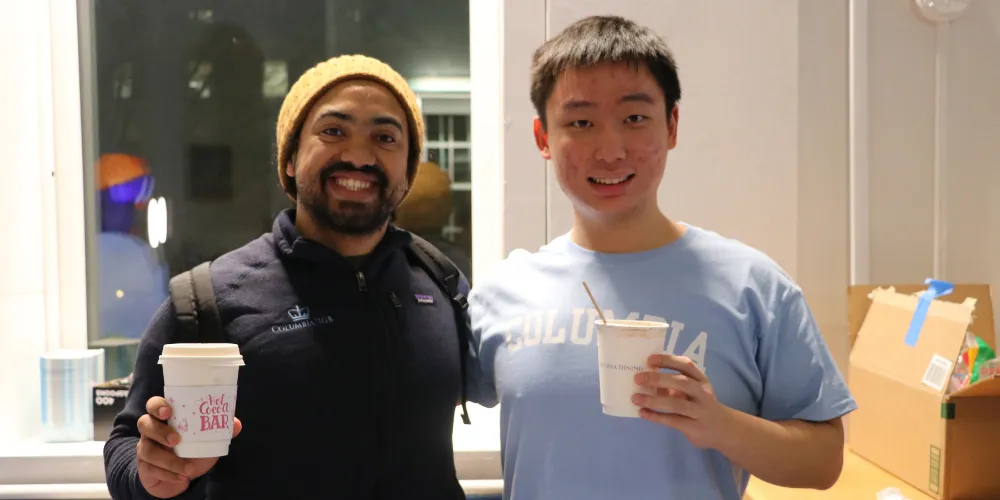 Student students smiling with hot chocolate