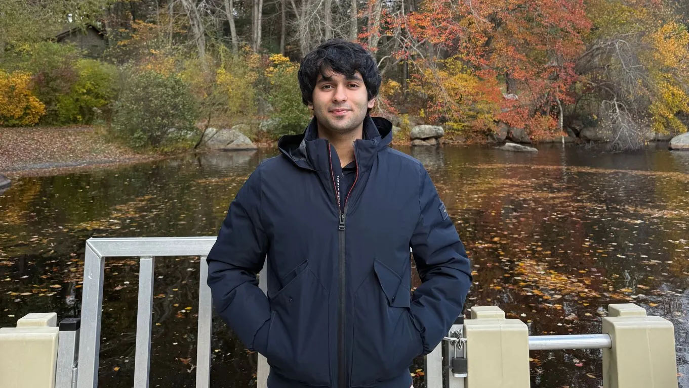 Haris Shah posing by a pond in a city park