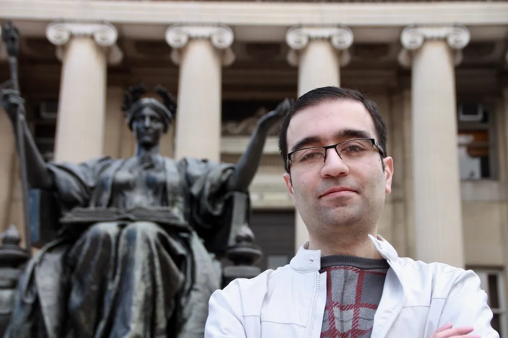 Kourosh Ziabari standing near Alma Mater on the Morningside Campus