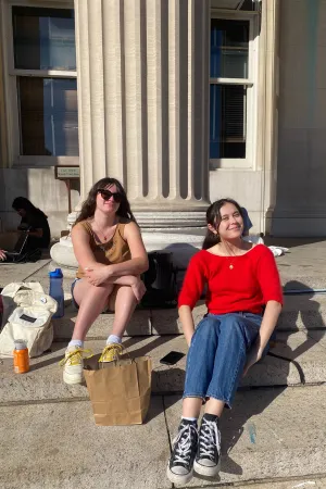 Maya sits outside on the Morningside campus